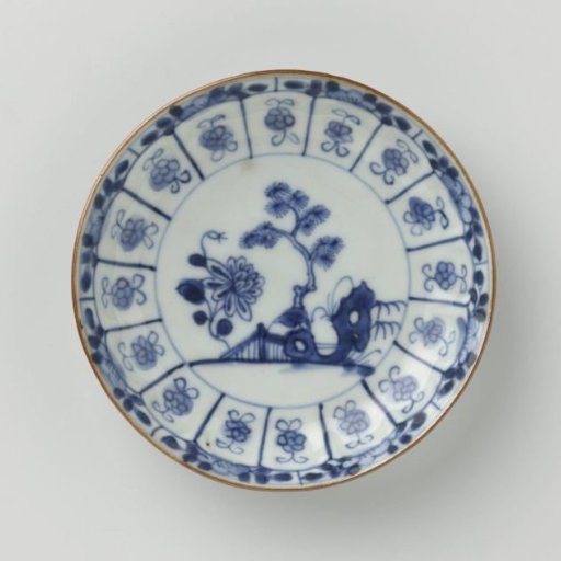Saucer-dish with flowering plants, a rock and stylized flower sprays