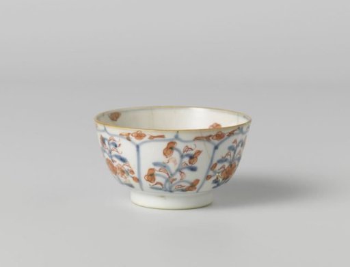 Cup with petal-shaped panel around a central medallion, filled with flower sprays