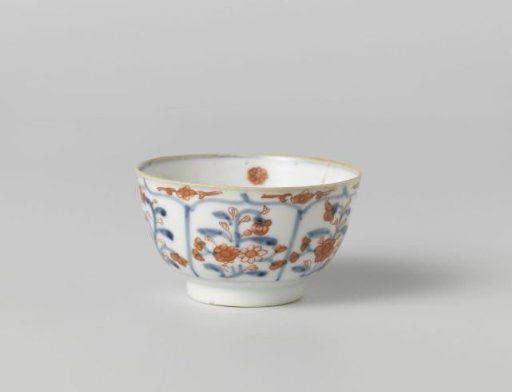Cup with petal-shaped panel around a central medallion, filled with flower sprays