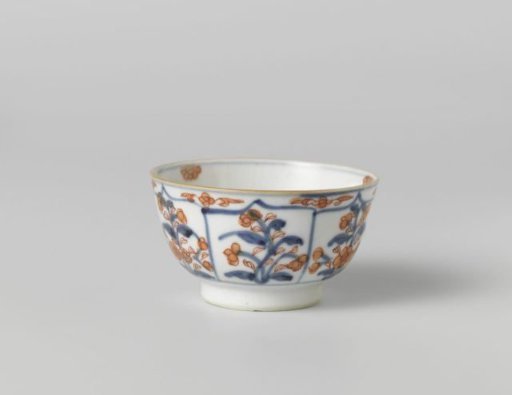 Cup with petal-shaped panel around a central medallion, filled with flower sprays