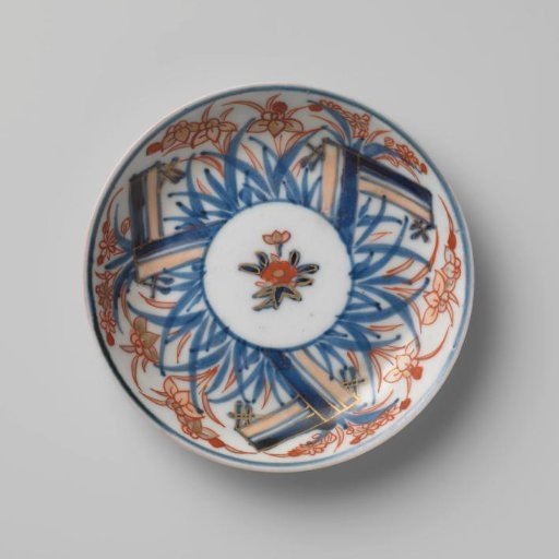 Saucer with a flower spray and flowering plants