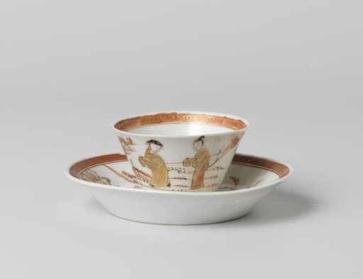 Cup and saucer with two figures in a water landscape and a flowering tree