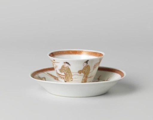 Cup and saucer with two figures in a water landscape and a flowering tree