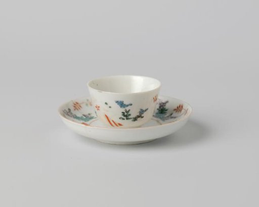 Saucer with lozenges and flowering plants