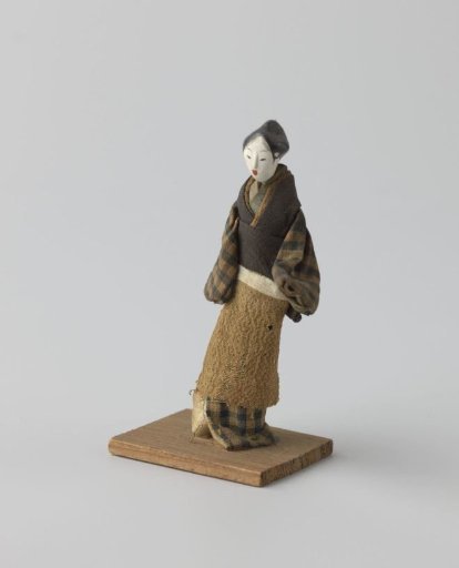 Wooden doll in Japanese clothing