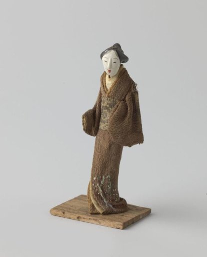 Wooden doll in Japanese clothing