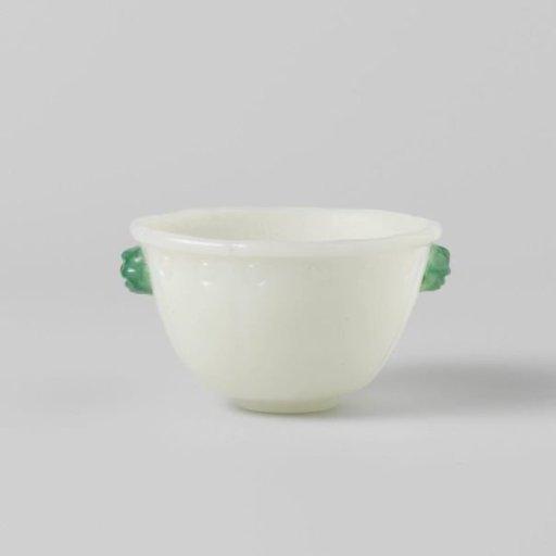 Small bowl of opaque white and jade-green glass