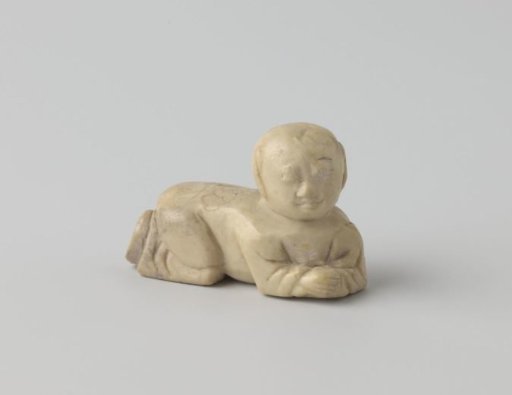 A crawling child figure in soapstone