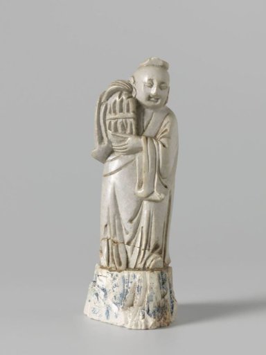 Male figure in grey soapstone carrying a birdcage