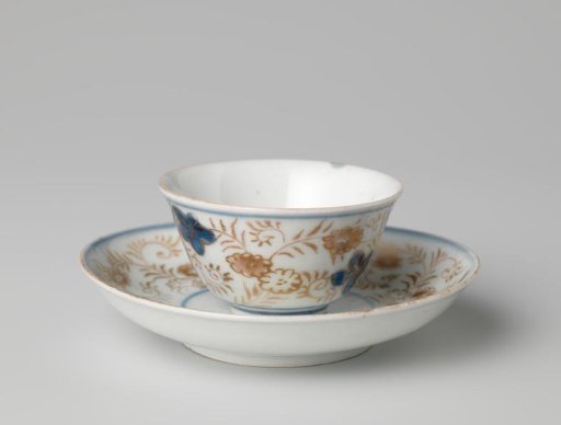 Bell-shaped cup and saucer with a flower basket and floral scrolls