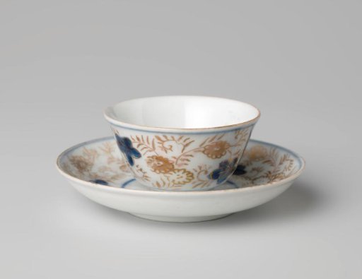 Bell-shaped cup and saucer with a flower basket and floral scrolls
