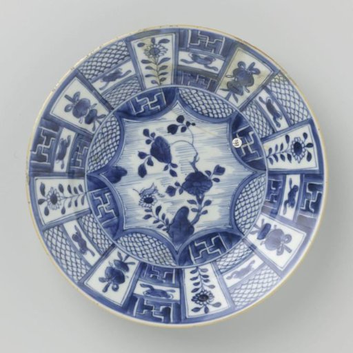 Plate with panel decoration with flower sprays and precious objects