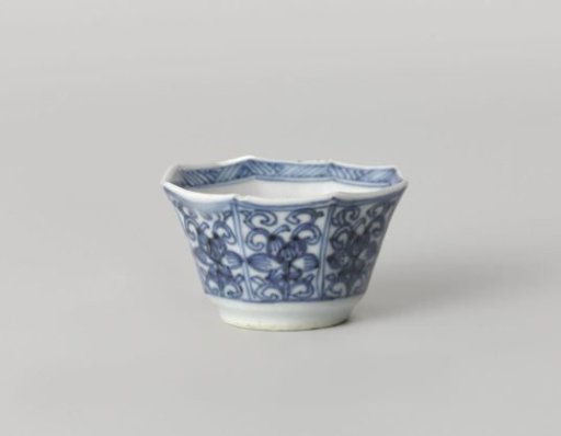 Octagonal cup with flower scrolls in panel decoration