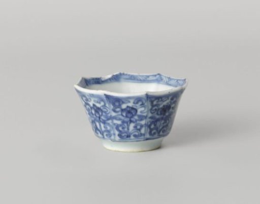 Octagonal cup with flower scrolls in panel decoration