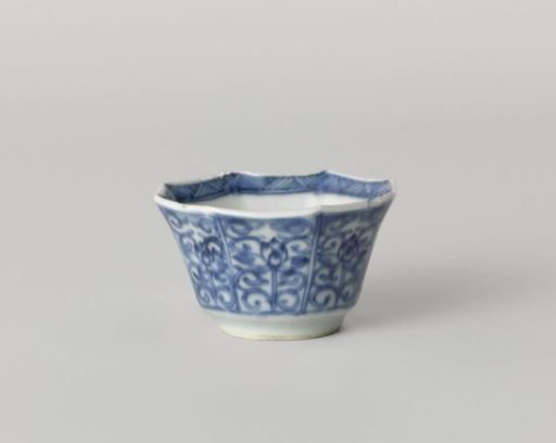 Octagonal cup with flower scrolls in panel decoration