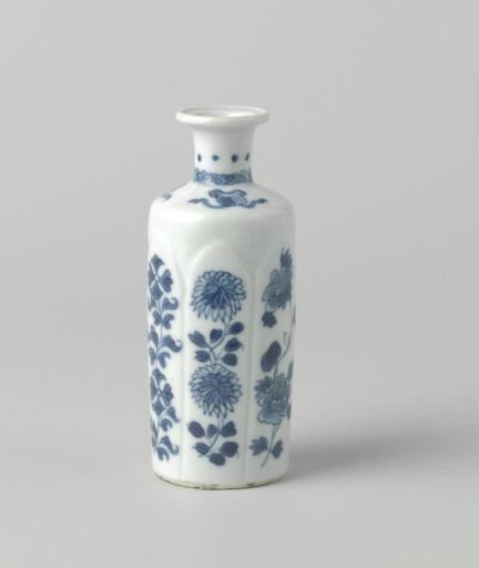 Cilindrical vase with flower sprays and precious objects
