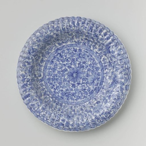 Plate with fluted sides and continuous flower pattern