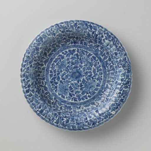 Plate with fluted sides and continuous flower pattern