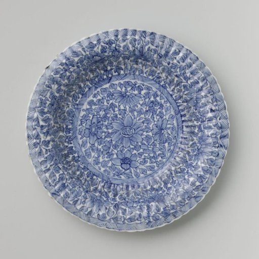 Plate with fluted sides and continuous flower pattern