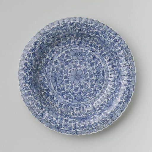 Plate with fluted sides and continuous flower pattern