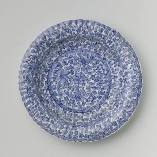 Plate with fluted sides and continuous flower pattern