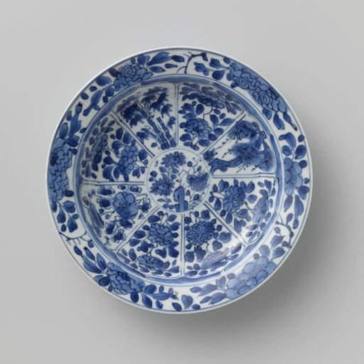 Saucer with panels in the shape of a flowerhead filled with flower sprays