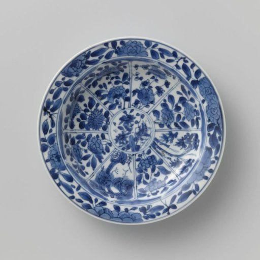 Saucer with panels in the shape of a flowerhead filled with flower sprays