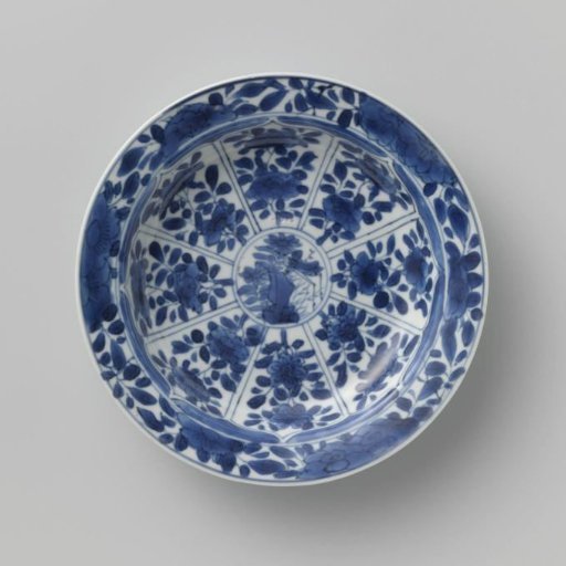 Saucer with panels in the shape of a flowerhead filled with flower sprays