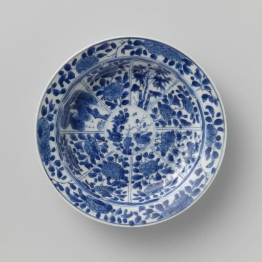 Saucer with panels in the shape of a flowerhead filled with flower sprays