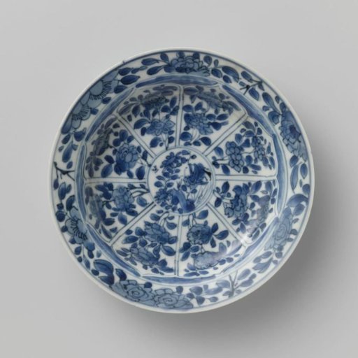 Saucer with panels in the shape of a flowerhead filled with flower sprays