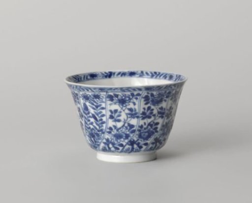 Cup with twisted panels with flower sprays