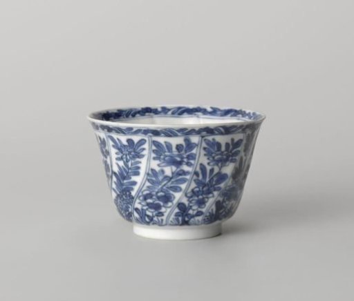Cup with twisted panels with flower sprays