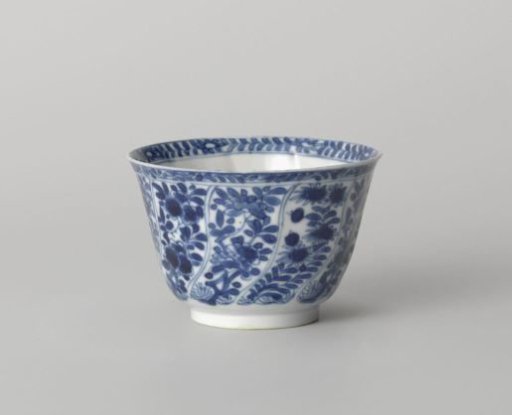 Cup with twisted panels with flower sprays