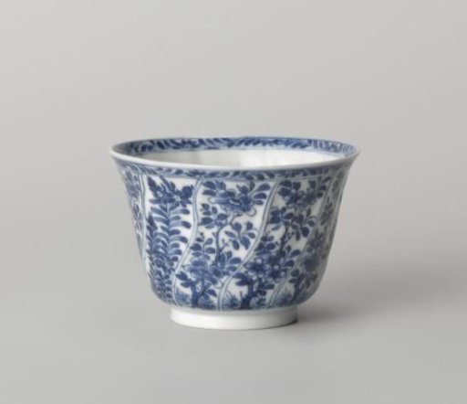 Cup with twisted panels with flower sprays