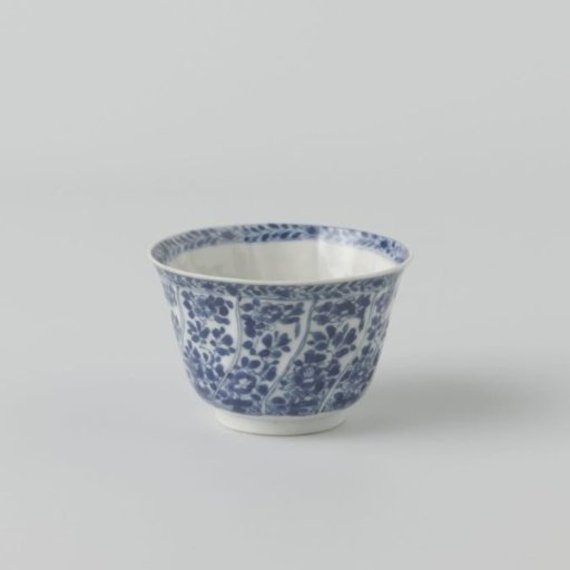 Cup with twisted panels with flower sprays