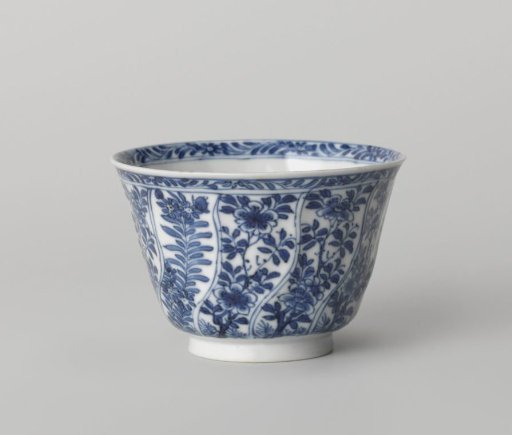 Cup with twisted panels with flower sprays