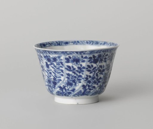 Cup with twisted panels with flower sprays