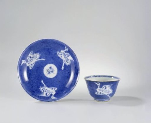Cup and saucer with powder blue and cranes