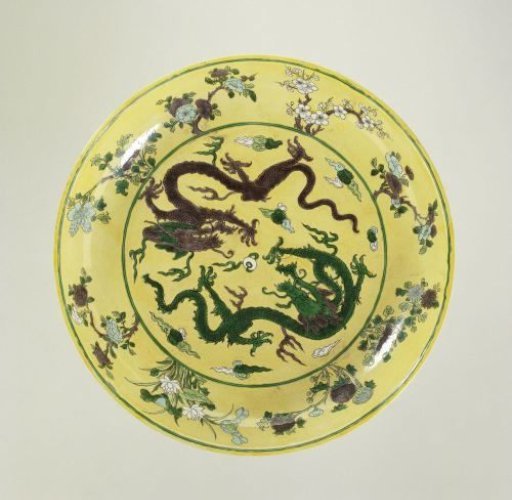 Saucer-dish with pearl chasing dragons against a yellow ground