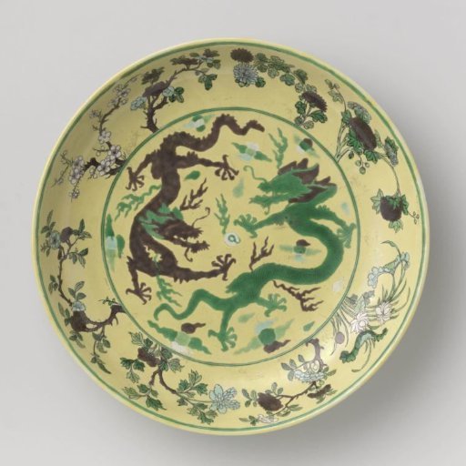 Saucer-dish with pearl chasing dragons against a yellow ground
