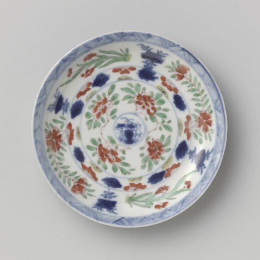 Saucer with flower sprays in panels on a black ground