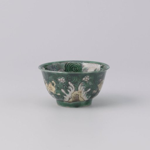 Bell-shaped cup with precious objects on a green ground with cloud motifs