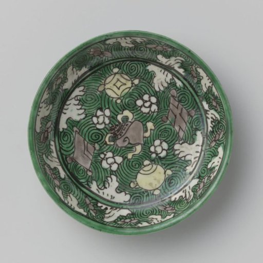 Saucer with precious objects on a green ground with cloud motifs