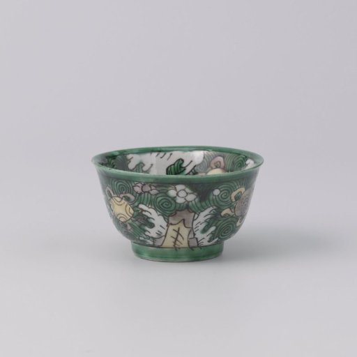 Bell-shaped cup with precious objects on a green ground with cloud motifs
