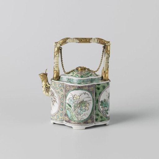 Four lobed tea pot with flowering plants