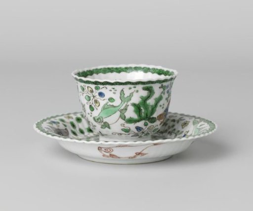 Cup and saucer with fish between water plants