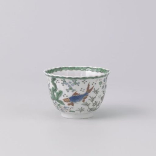 Cup with fish between water plants