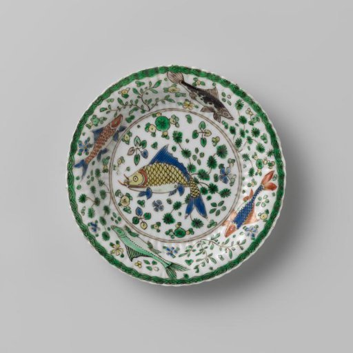 Saucer with fish between water plants
