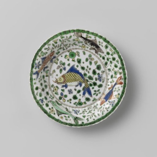 Cup and saucer with fish between water plants