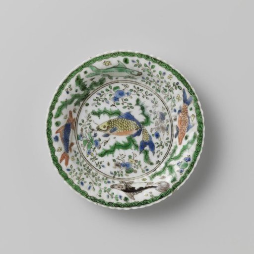 Cup and saucer with fish between water plants